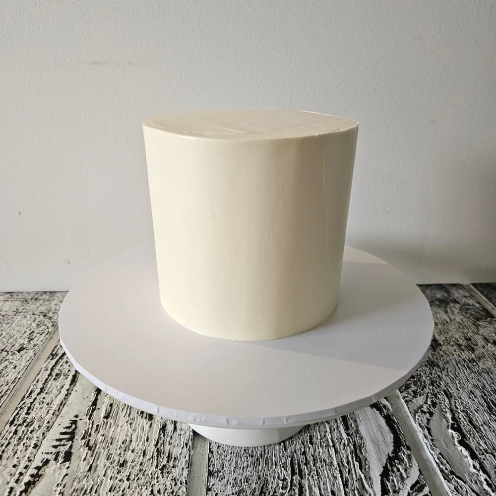 Plain full-buttercream cake ready for custom decoration, made by Amour Desserts in Melbourne